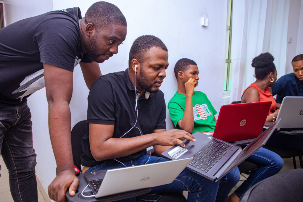 young african men learning with laptop