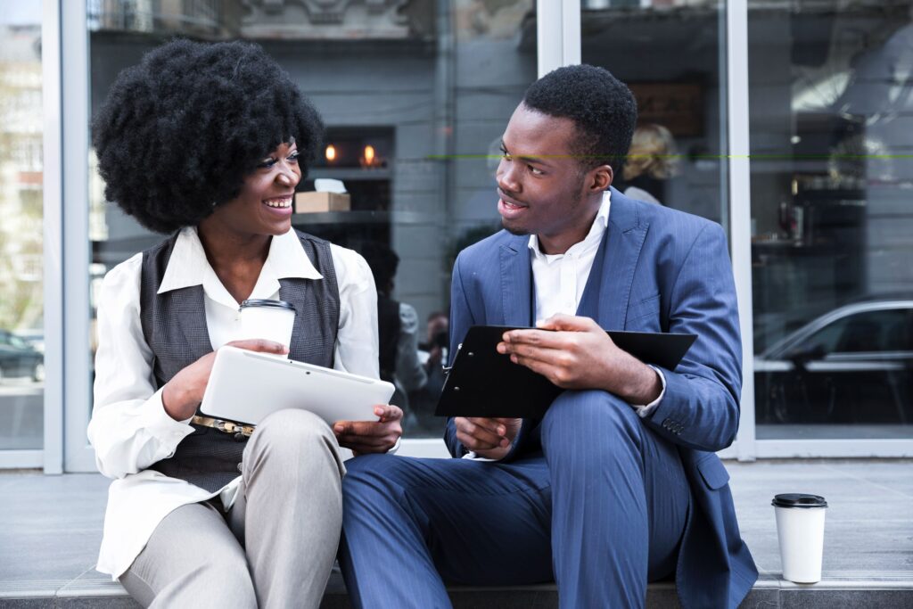 man and woman smiling and talking